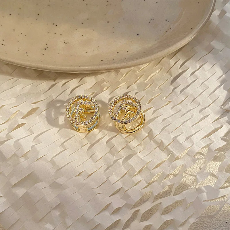 Fashionable Earrings Feature A Super-shiny Ear Clasp, Simple and Niche Design, Round Shape, and Compact Size